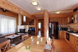 Kitchen living room in a wooden house real photos