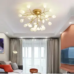 Ceiling with spotlights and chandelier in the living room photo