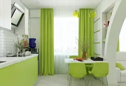 Combination of green color in the interior of the kitchen and living room