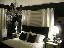 Bedroom design with black curtains