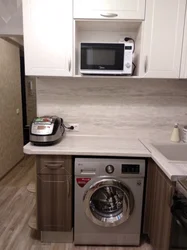 Design of a small kitchen in Khrushchev with a refrigerator and washing machine