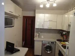 Design of a small kitchen in Khrushchev with a refrigerator and washing machine