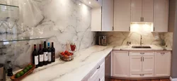 Kitchen design with marble countertops and splashback