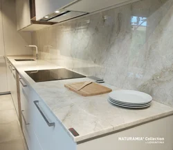 Kitchen design with marble countertops and splashback