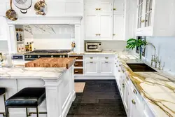 Kitchen design with marble countertops and splashback