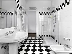 White bathtub with black floor photo