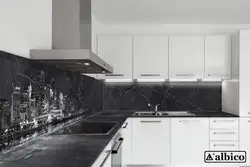 Kitchen with a black apron and countertop in a white interior