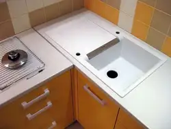 Square sink in the corner of the kitchen photo