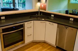 Square sink in the corner of the kitchen photo