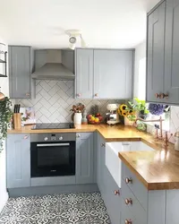 Gray kitchen design with wooden countertops