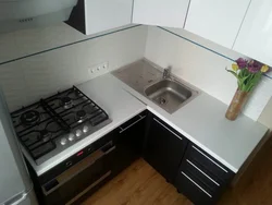 Corner Kitchens With A Sink In The Corner And A Refrigerator Photo
