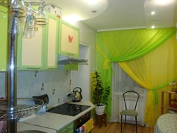 Green wallpaper and curtains in the kitchen photo