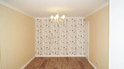 Wallpapering a living room in an apartment photo