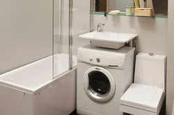 Интерьер маленькой ванны с раковиной и стиральной машиной