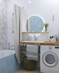 Интерьер маленькой ванны с раковиной и стиральной машиной