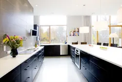 Black kitchen design without upper cabinets