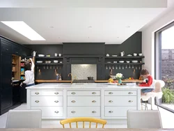 Black kitchen design without upper cabinets