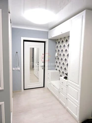 White Hallway With Mirror Design