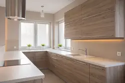 Photo of a kitchen with beige cabinets