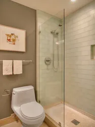 Bathroom design with toilet and shower with tray