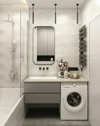 Design of a combined bathroom with bathtub and washing machine photo