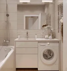 Design Of A Combined Bathroom With Bathtub And Washing Machine Photo