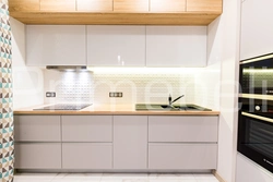 White Kitchen With Wooden Countertop Photo