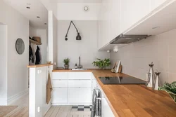 White kitchen with wooden countertop photo