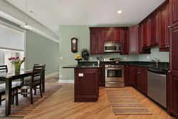 Kitchen design photo with brown furniture photo