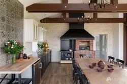 Photo of a kitchen with a stove in a wooden house photo