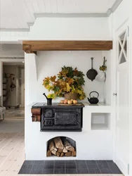 Photo Of A Kitchen With A Stove In A Wooden House Photo