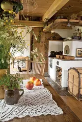 Photo of a kitchen with a stove in a wooden house photo