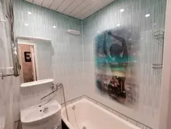 Bathtub covered with PVC panels photo