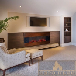 Photo Of A Living Room With A Fireplace And TV In An Apartment