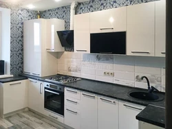 White glossy kitchen with black countertop photo