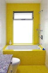 Yellow tiles in the bathroom photo design