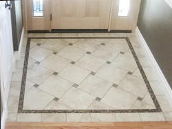 Tiles on the floor in the kitchen and hallway photo in the apartment