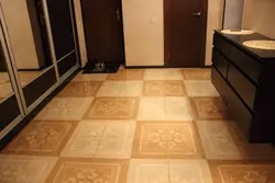 Tiles on the floor in the kitchen and hallway photo in the apartment