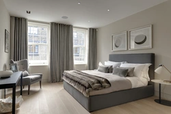 Gray curtains in the bedroom interior