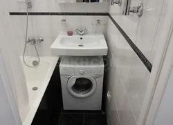 Interior design of a small bathroom with a washing machine