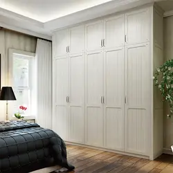 Modern bedroom wardrobe with hinged doors photo design