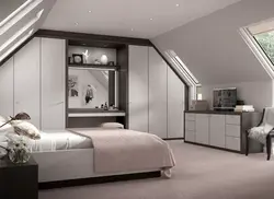 Bedroom interior in a house with a sloping ceiling