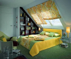 Bedroom interior in a house with a sloping ceiling