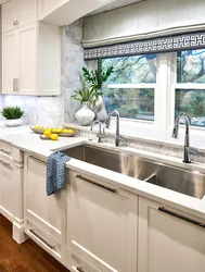 Kitchen design photo with sink by the window photo