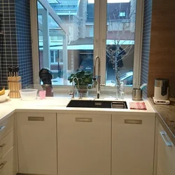 Kitchen design photo with sink by the window photo