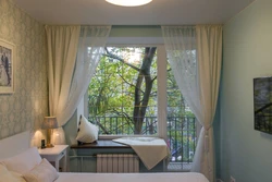 Balcony bedroom design photo with exit