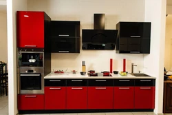 Red and black kitchen in the interior photo