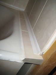 Joints between bathroom and wall photo