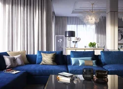 Curtains in the interior of the living room with a blue sofa photo