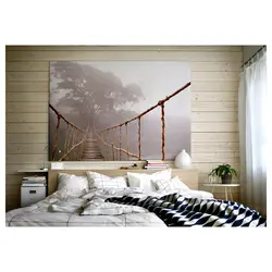 Photo on the wall in a modern bedroom interior